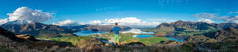 Hiker is looking out for Wanaka Lake and mountains, Rocky Peak