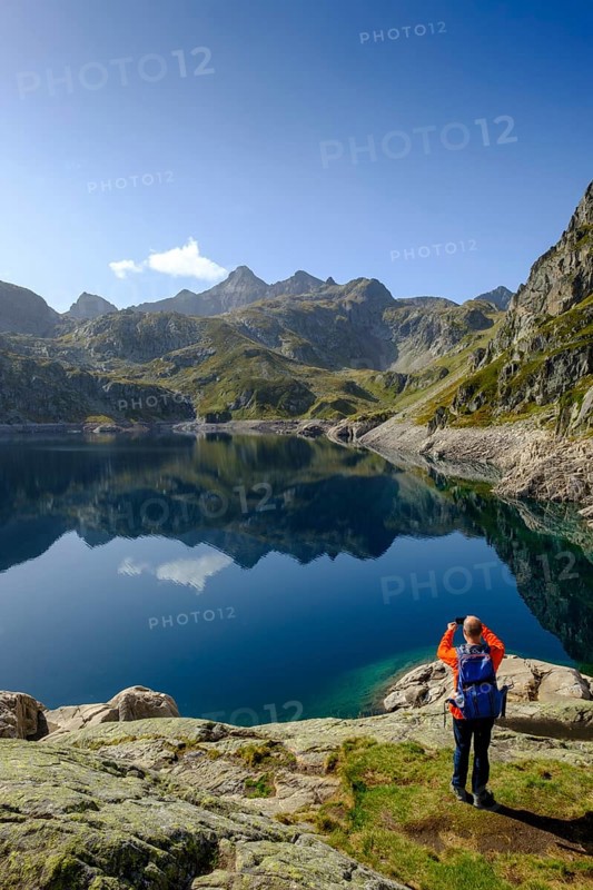 Hikers at the mountain lake, Lac d'Artouste