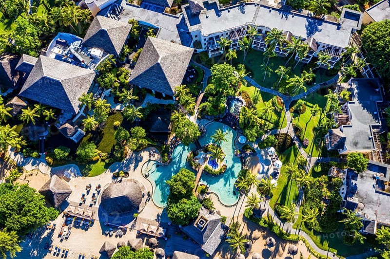 Beach of Flic en Flac with the luxury hotel Sugar Beach Golf & Spa Resort and palm trees, Mauritius