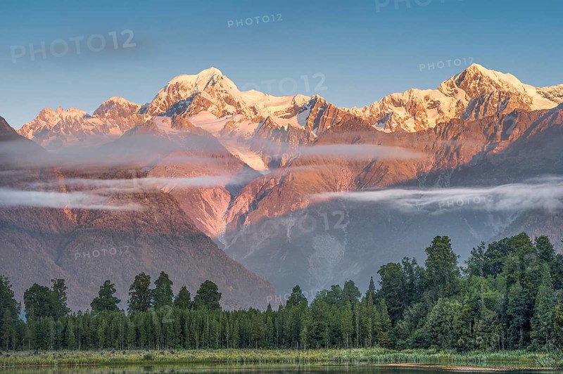 Snowy mountain peaks Mount Cook and Mount Tasman in the evening light, Westland National Park