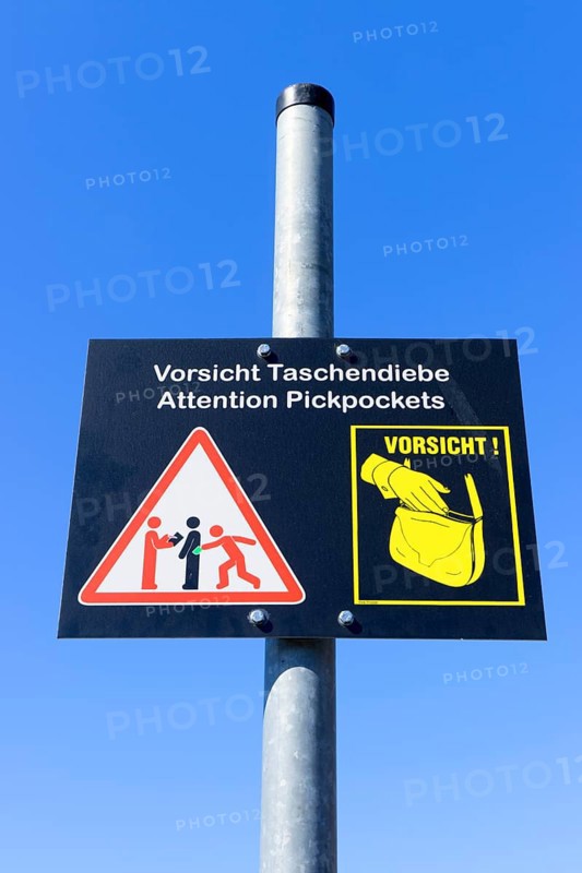Plaque with a warning sign for pickpockets, Berlin