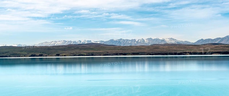 Blue glacier lake Lake Pukaki with mountain range, Mount Cook National Park