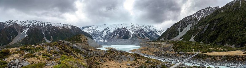Hanging bridge over Hooker River, behind Hooker Lake and Mount Cook