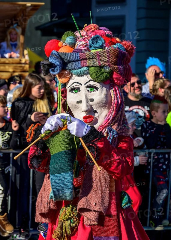 Masked person, knitting woman
