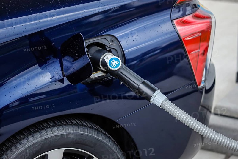 Passenger car refuels H2 hydrogen at a H2 hydrogen filling station, Herten