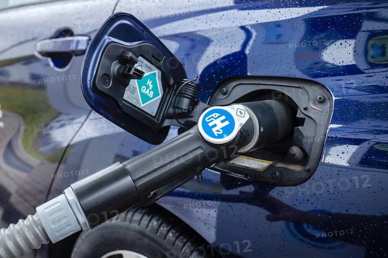 Passenger car refuels H2 hydrogen at a H2 hydrogen filling station, Herten