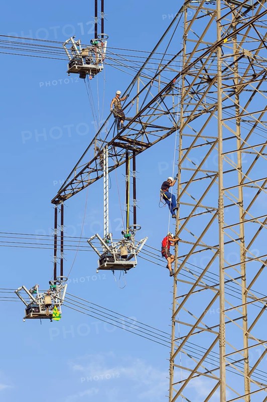 High voltage engineers working on the high voltage pylon, Baden-Wuerttemberg