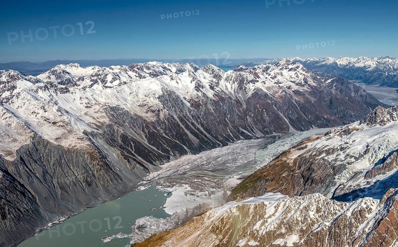 Valley with glacial lake Tasman Lake and glaciated mountain peaks