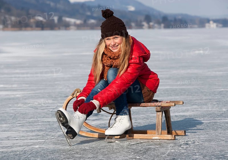 Young girl ice skating at the lake