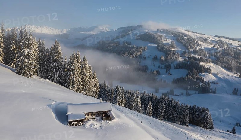 Snowy mountain hut in winter
