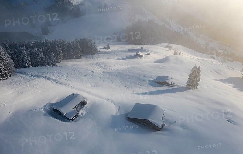 Snowy mountain huts in winter