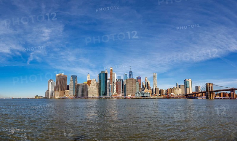 View from Pier 1 over the East River to the skyline of Lower Manhattan with Brooklyn Bridge