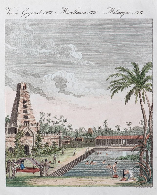 South Indian temple with temple pond and bathing Hindus