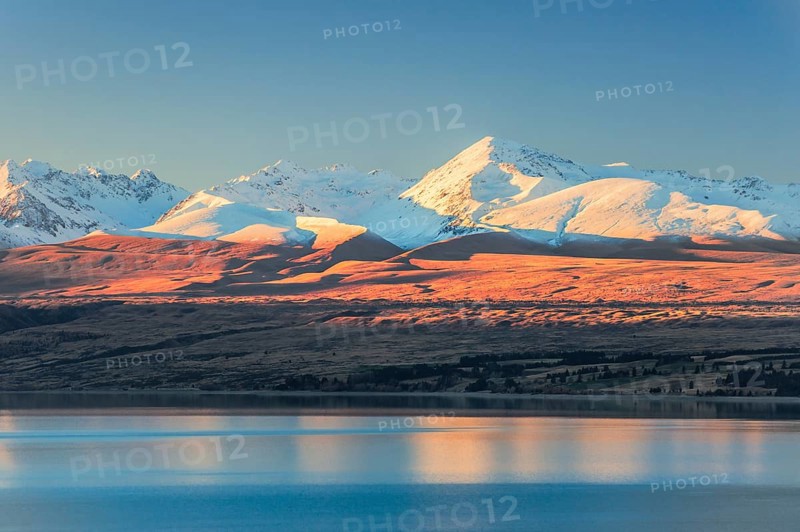 Lake Pukaki in front of snowy mountain range