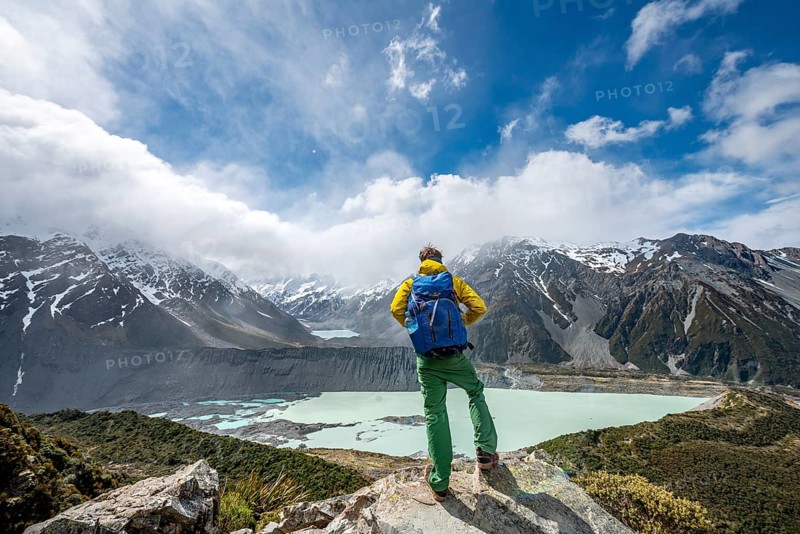 Hiker stands on rocks