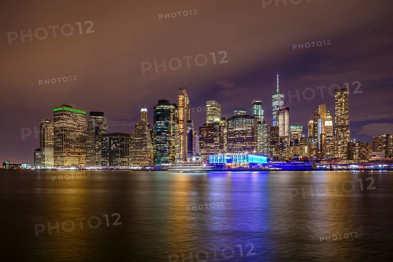 View from Pier 1 at night over the East River to the skyline of lower Manhattan
