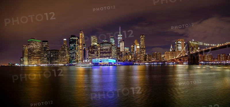 View from Pier 1 at night over the East River to the skyline of lower Manhattan