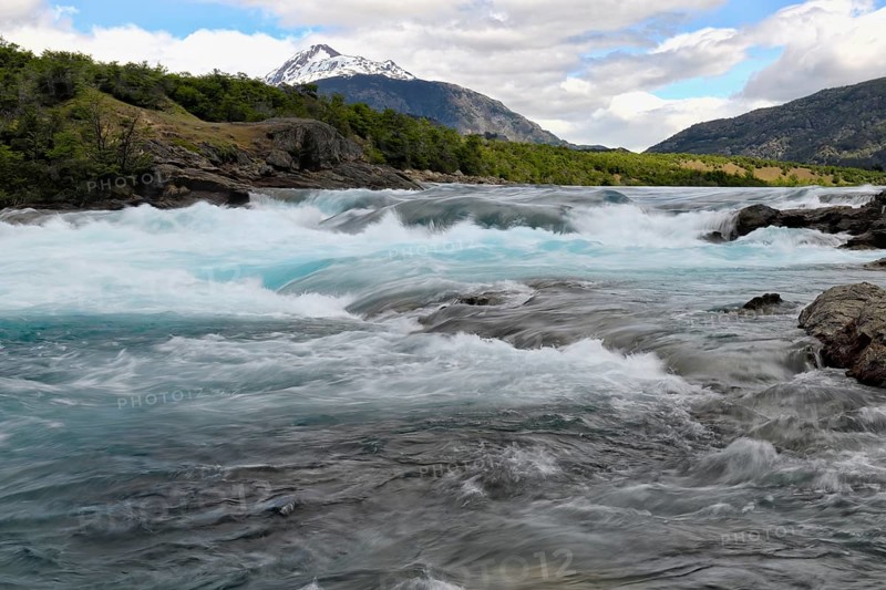 Rapids at the confluence of blue Baker river and grey Neff river