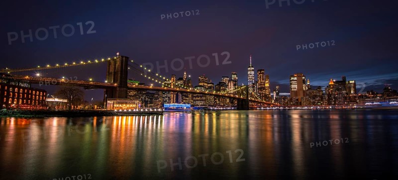 View from Main Street Park at night over the East River to the skyline of lower Manhattan