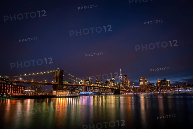 View from Main Street Park at night over the East River to the skyline of lower Manhattan