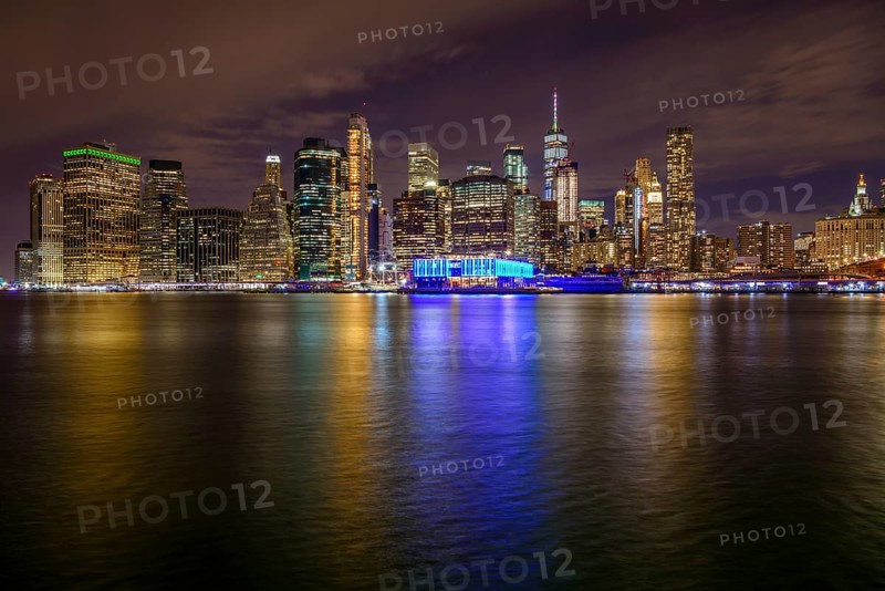 View from Pier 1 at night over the East River to the skyline of lower Manhattan