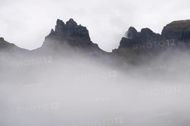 Cloud-covered rugged mountain peaks