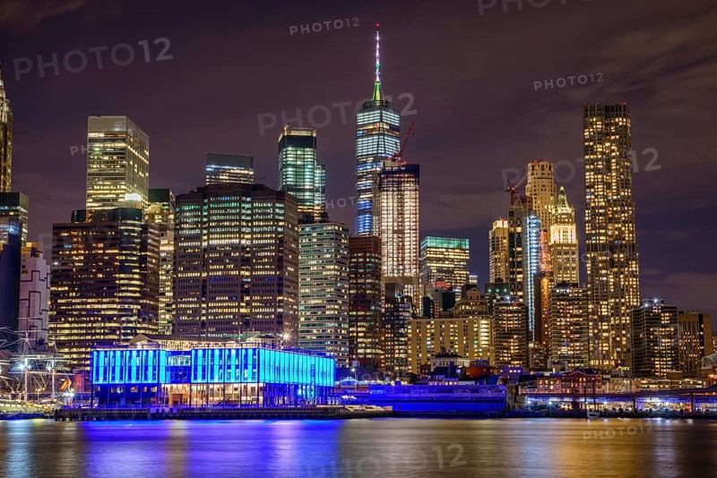 View from Pier 1 at night over the East River to the skyline of lower Manhattan