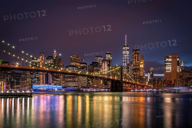 View from Main Street Park at night over the East River to the skyline of lower Manhattan