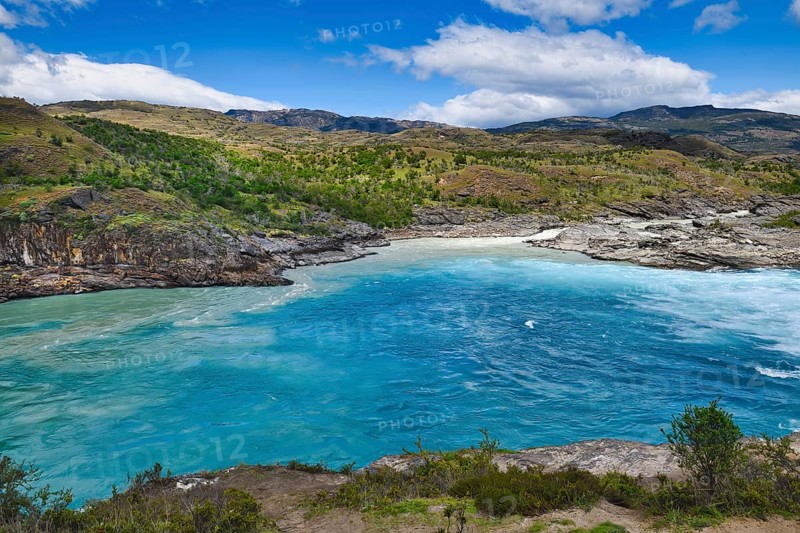 Rapids at the confluence of blue Baker river and grey Neff river