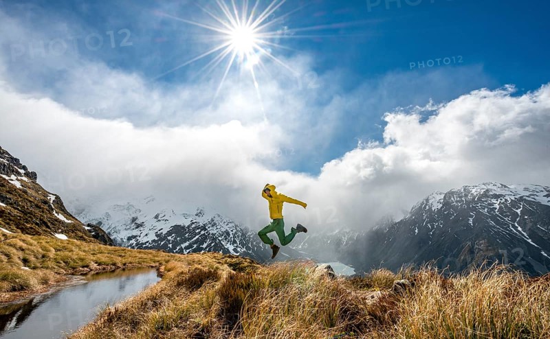 Hiker jumps into the air