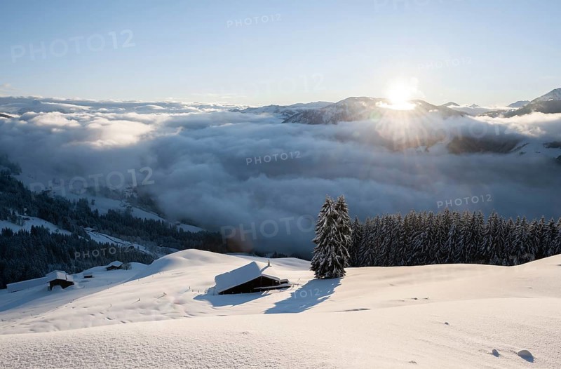 View of the Brixen Valley with morning sun and high fog in winter