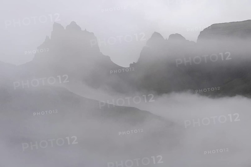 Cloud-covered rugged mountain peaks