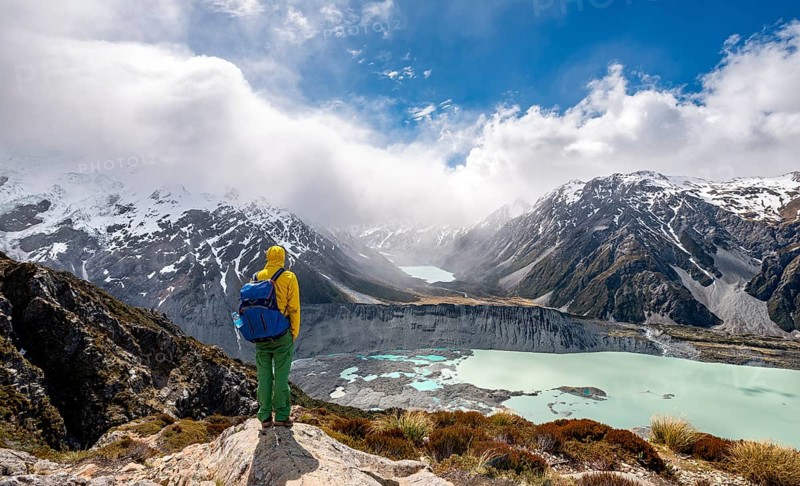 Hiker stands on rocks