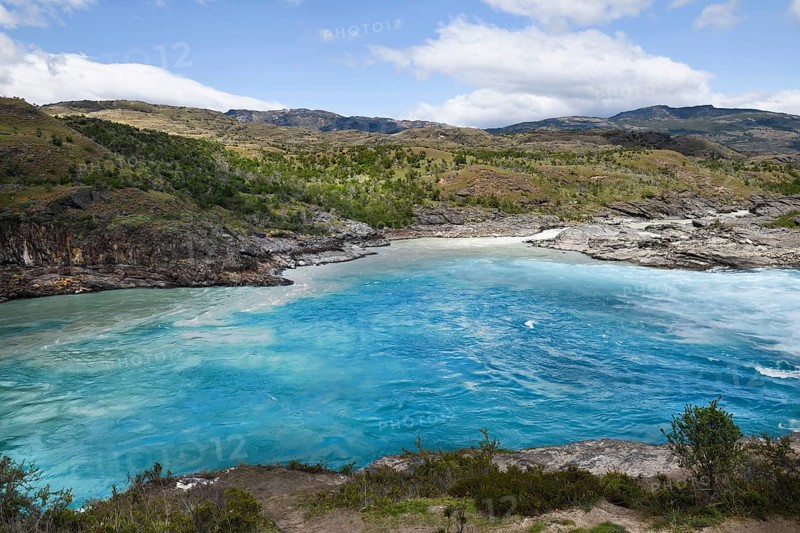 Rapids at the confluence of blue Baker river and grey Neff river