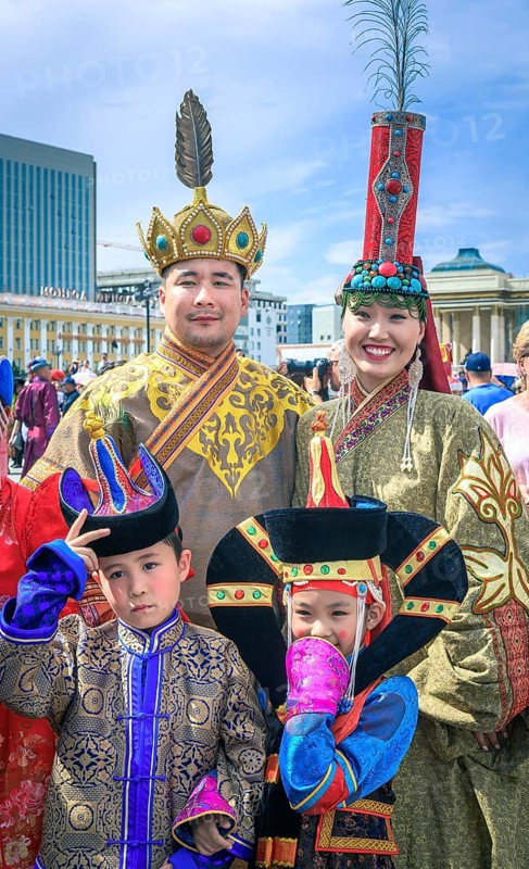 Mongolian family in traditional costumes in the DEEL