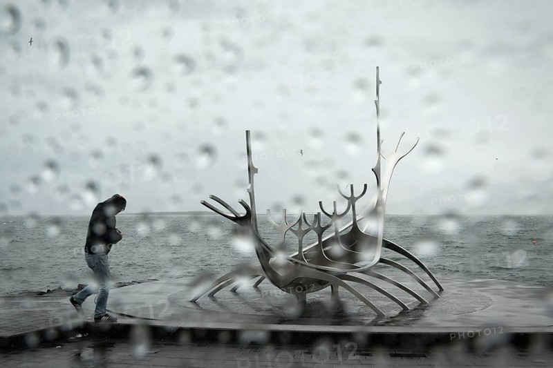Tourist in rain at the sun ship
