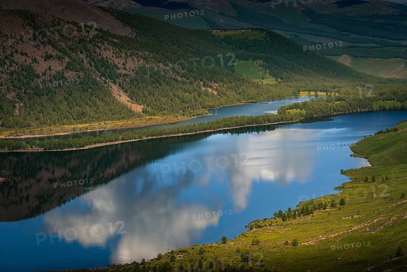 Reflection of cloudy sky in the Shireet lake