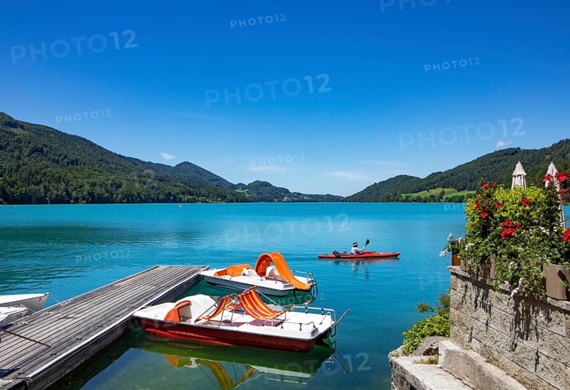 Pedal boats at the landing stage on the lake promenade