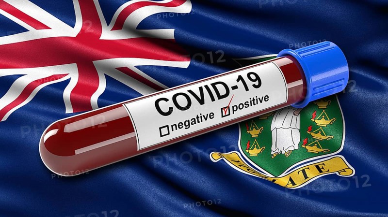 Flag of British Virgin Islands waving in the wind with a positive Covid-19 blood tube