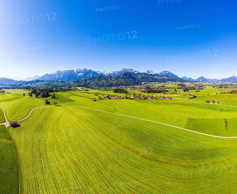 Villages in cultural landscape in front of the Tannheimer Berge with Hohe Schlicke