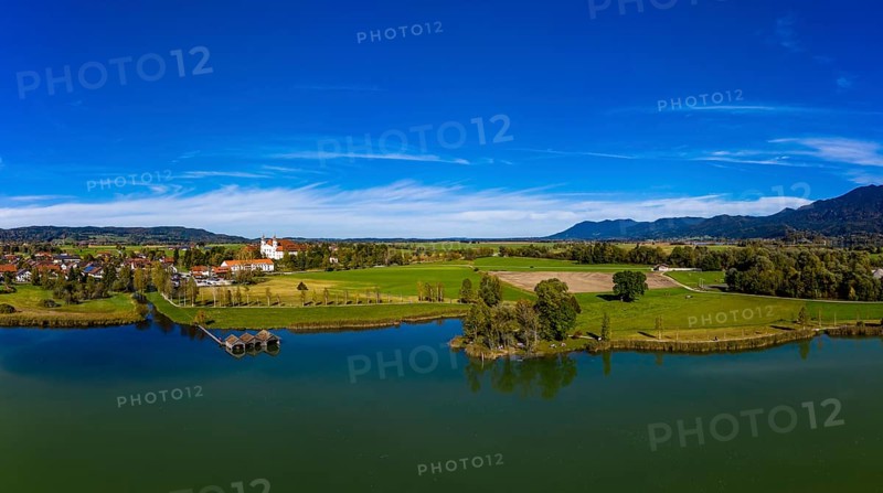 Aerial view of Schlehdorf Monastery with St. Tertulin Parish Church at Lake Lake Kochel
