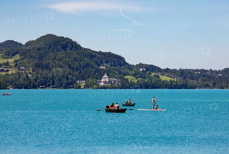 Boats at the Fuschlsee with castle Fuschl