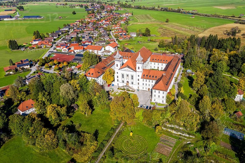 Aerial view of Schlehdorf Monastery with St. Tertulin Parish Church at Lake Lake Kochel