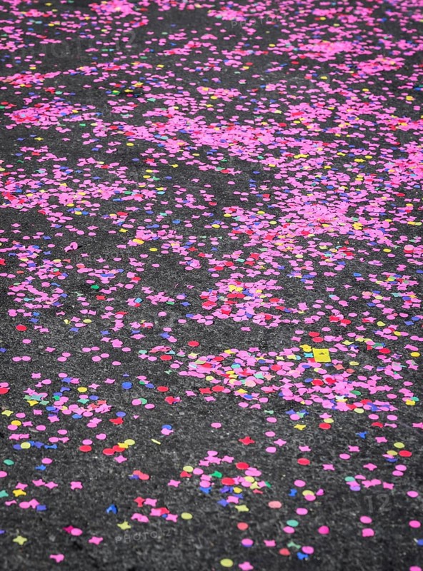 Colourful confetti after a carnival procession in the street