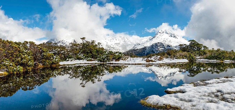 Small mountain lake with reflection
