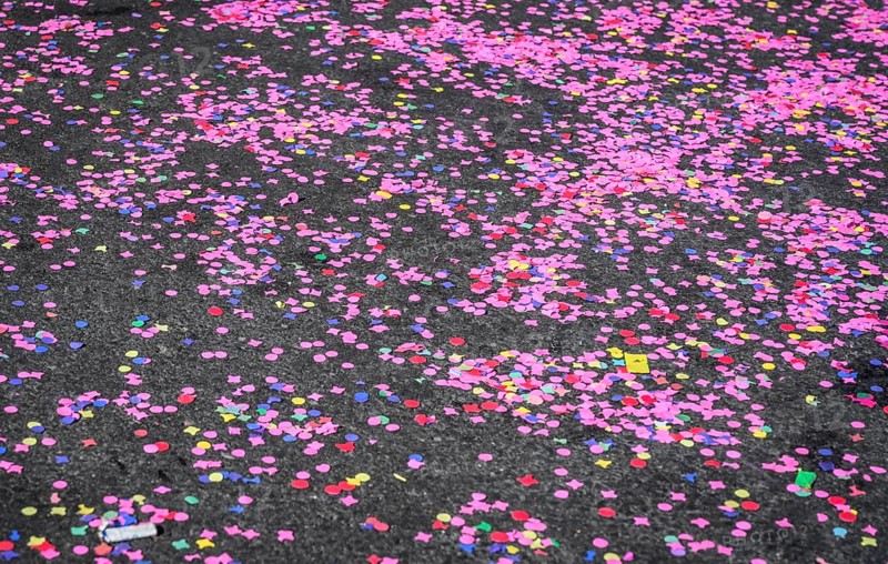 Colourful confetti after a carnival procession in the street