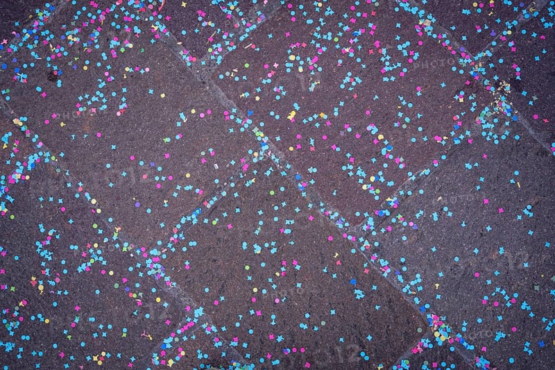 Colourful confetti after a carnival procession in the street