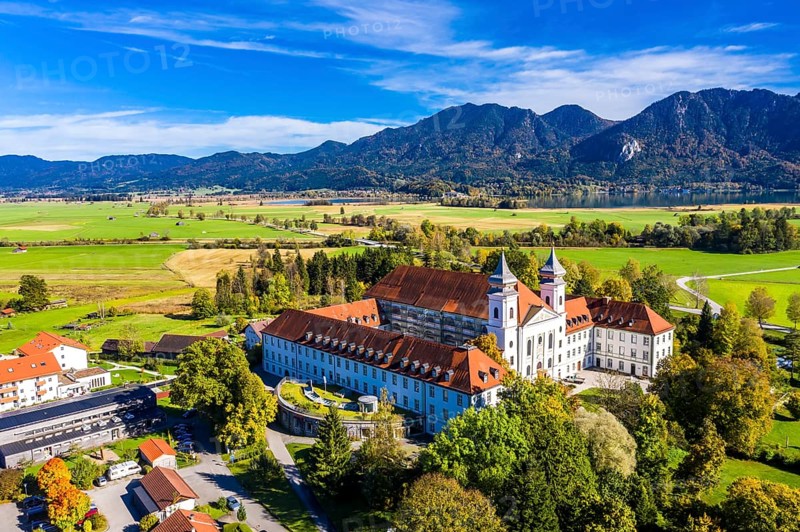 Aerial view of Schlehdorf Monastery with St. Tertulin Parish Church at Lake Lake Kochel