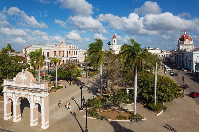 Porticoed Neoclassical buildings frame the Parque Jose Marti