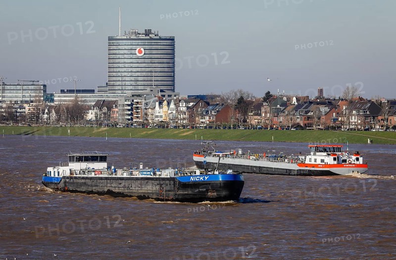 Freighters navigating on the Rhine during floods
